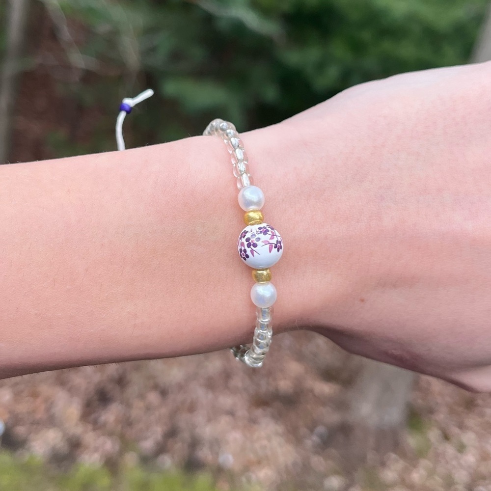 Handmade beaded tie on bracelet purple and gold